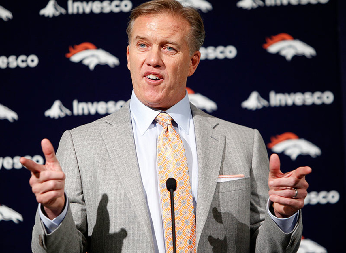Elway arrived at his hiring press conference in 2011 with guns blazing, answering all questions that came his way. (Ed Andrieski/AP)