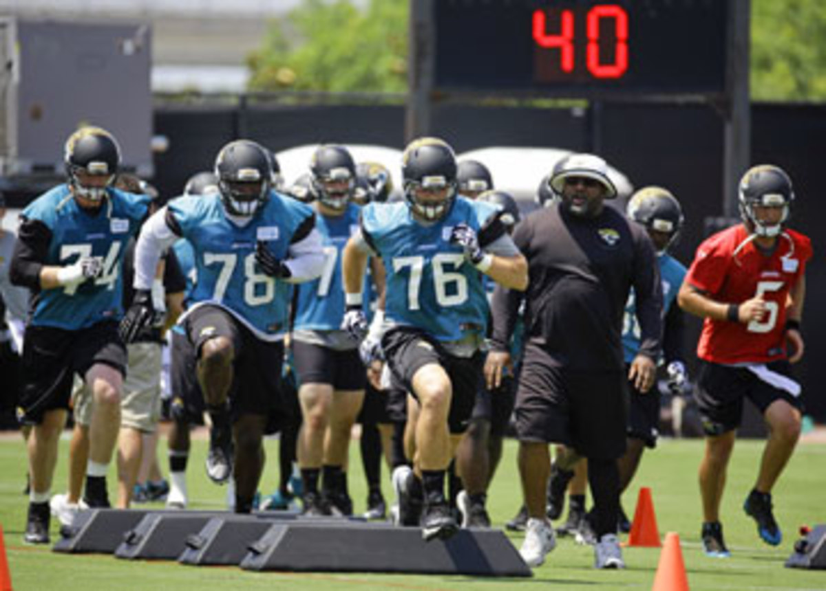 Making the transition from right tackle to left this season, Luke Joeckel (76) will essentially be a rookie again after playing just five games in 2013 before breaking an ankle. (John Raoux/AP)