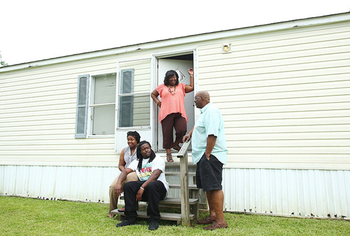 Eddie Lacy (bottom) built a new house for his family, just seven minutes from the trailer they lived in before.