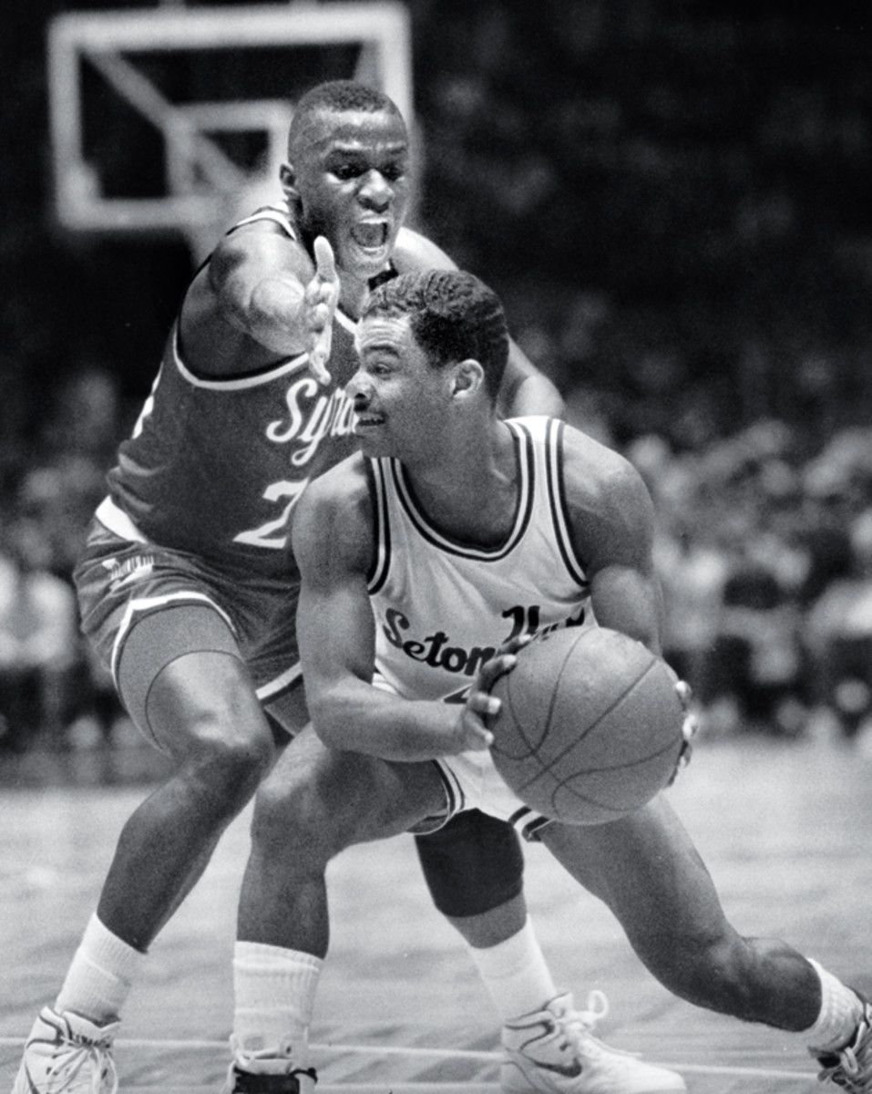 Even 6-foot Sherman Douglas of Syracuse (left) towered over Wigington.