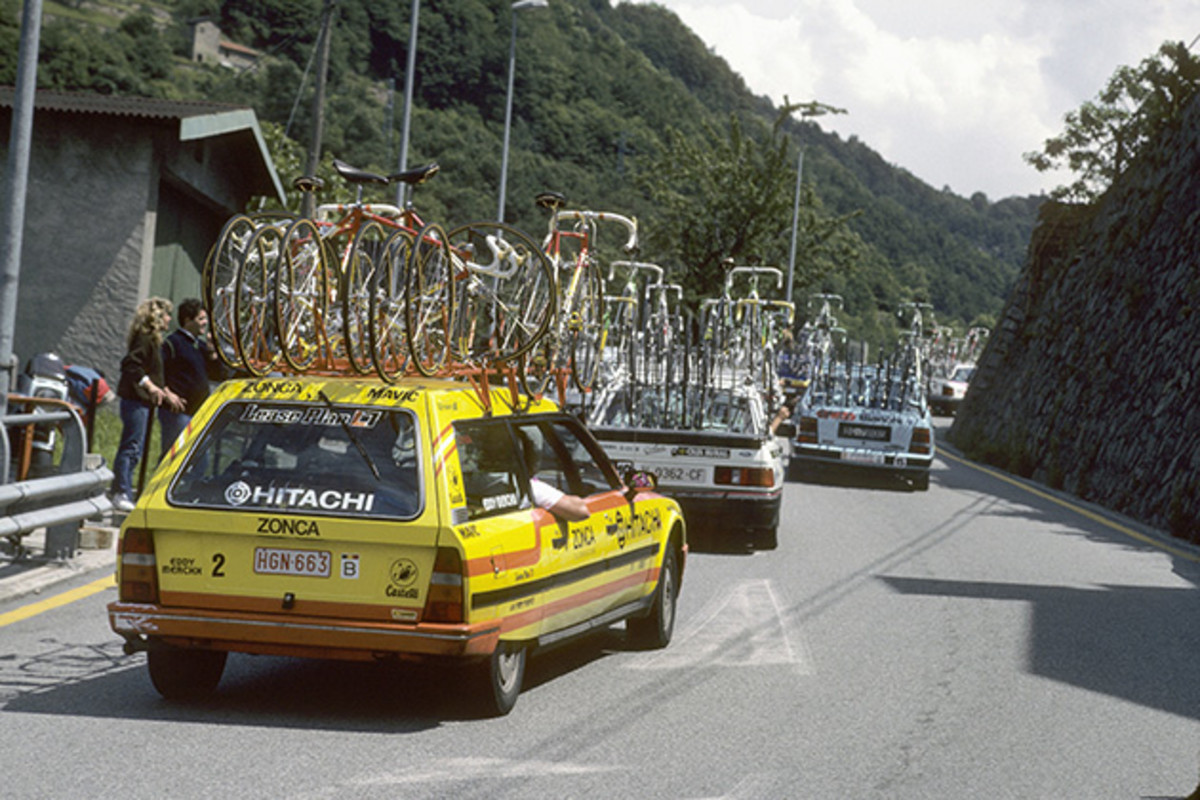 Support cars are shown during the 1989 Tour de France.