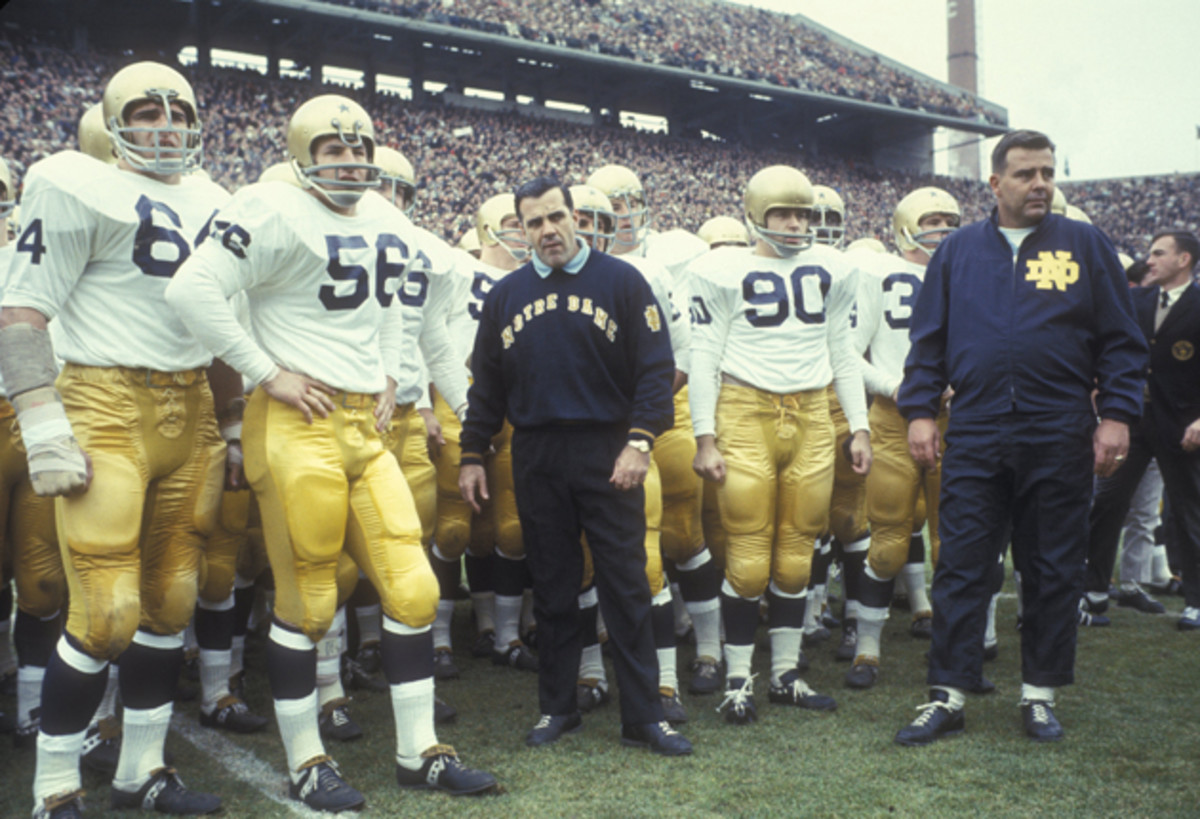 Ara Parseghian, head coach of Notre Dame, on the sidelines with team.
