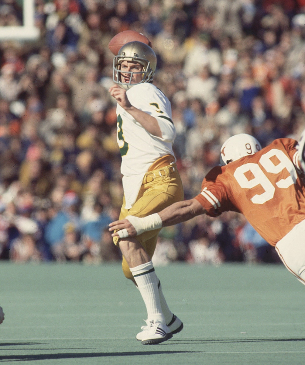 Notre Dame QB Joe Montana (3) making pass vs Texas Steve McMichael (99). 
