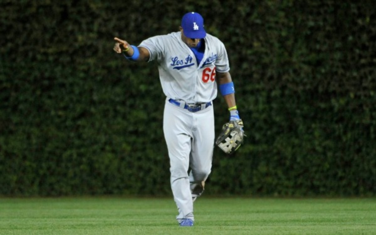 Yasiel Puig will be day-to-day after injuring his wrist on a diving catch. (David Banks/Getty Images)