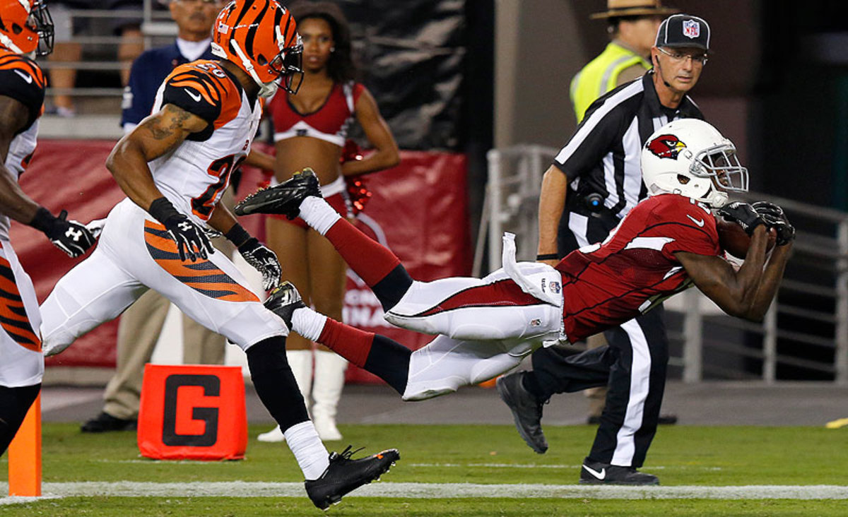 Cards rookie John Brown has 10 catches for 165 yards and this diving touchdown in three preseason games. (Matt York/AP)