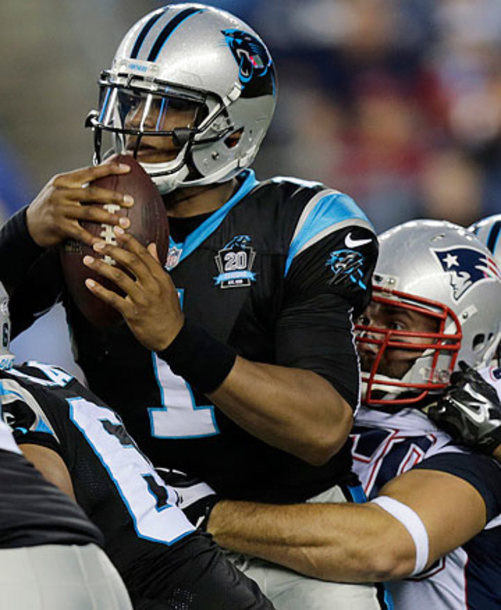 Cam Newton injured his ribs in Friday's loss to the Patriots. (Charles Krupa/AP)