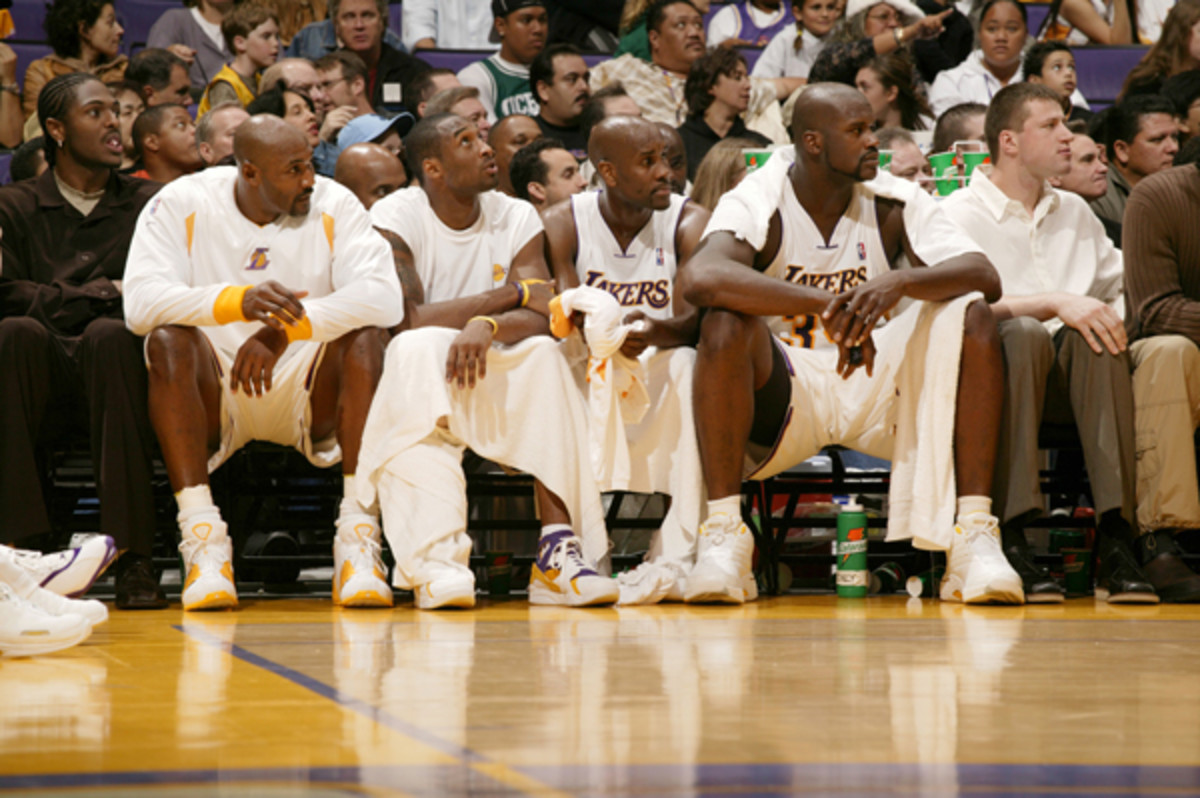 Malone is joined by Kobe Bryant, Gary Payton and Shaquille O'Neal on the bench during a game Nov. 2003 game against Golden State.  (John W. McDonough/SI)