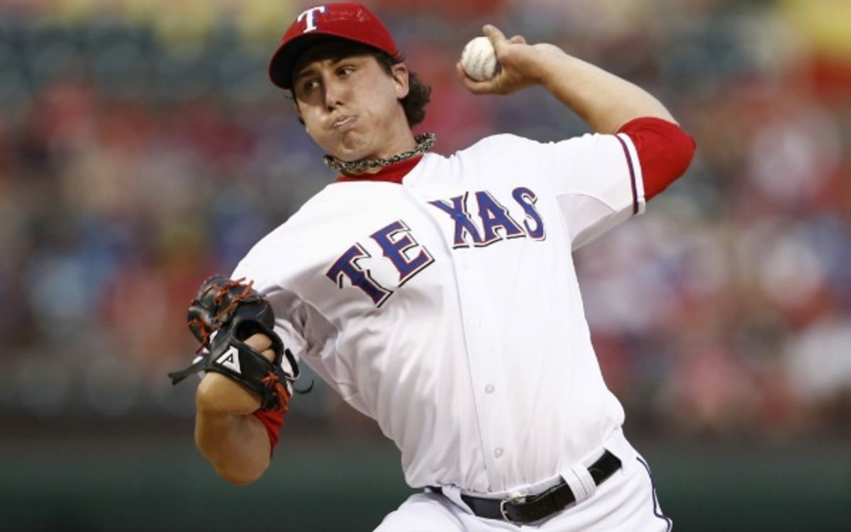 Rangers pitcher Derek Holland has a career record of 49-38 in four MLB seasons. (Fort Worth Star-Telegram/Getty Images)