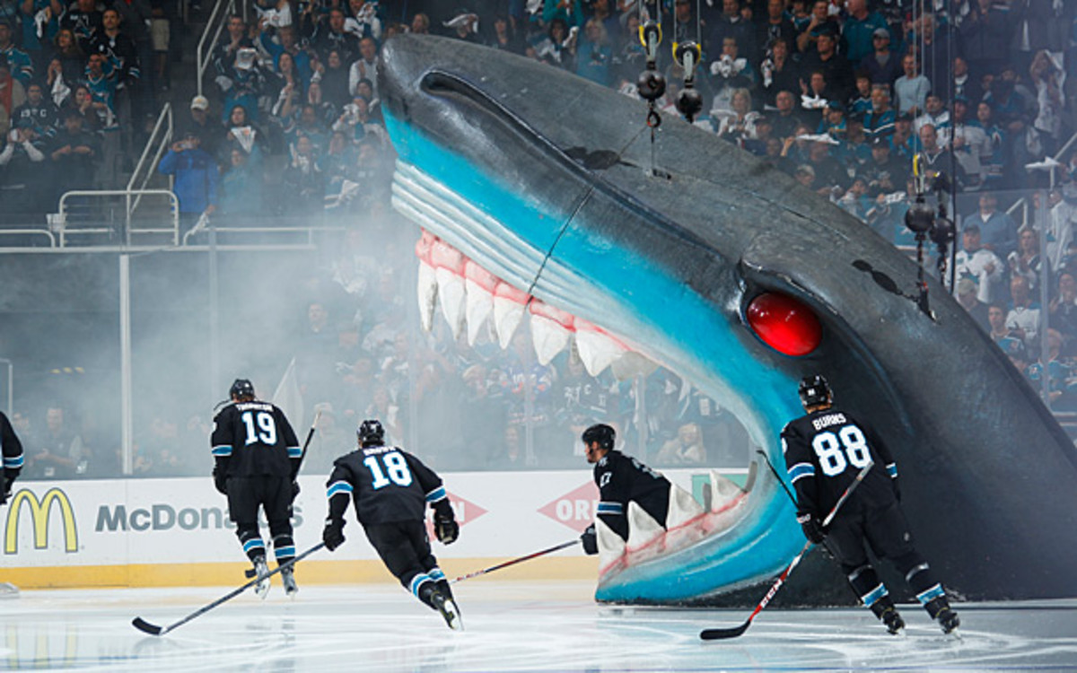 San Jose Sharks skate onto the ice through a giant shark's mouth.
