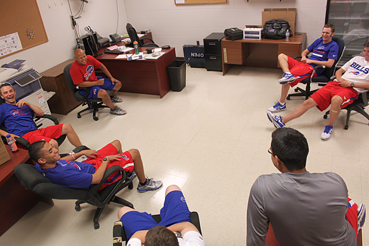 Interns relax in what will be the camp's trainer's room. (Robert Klemko/The MMQB)