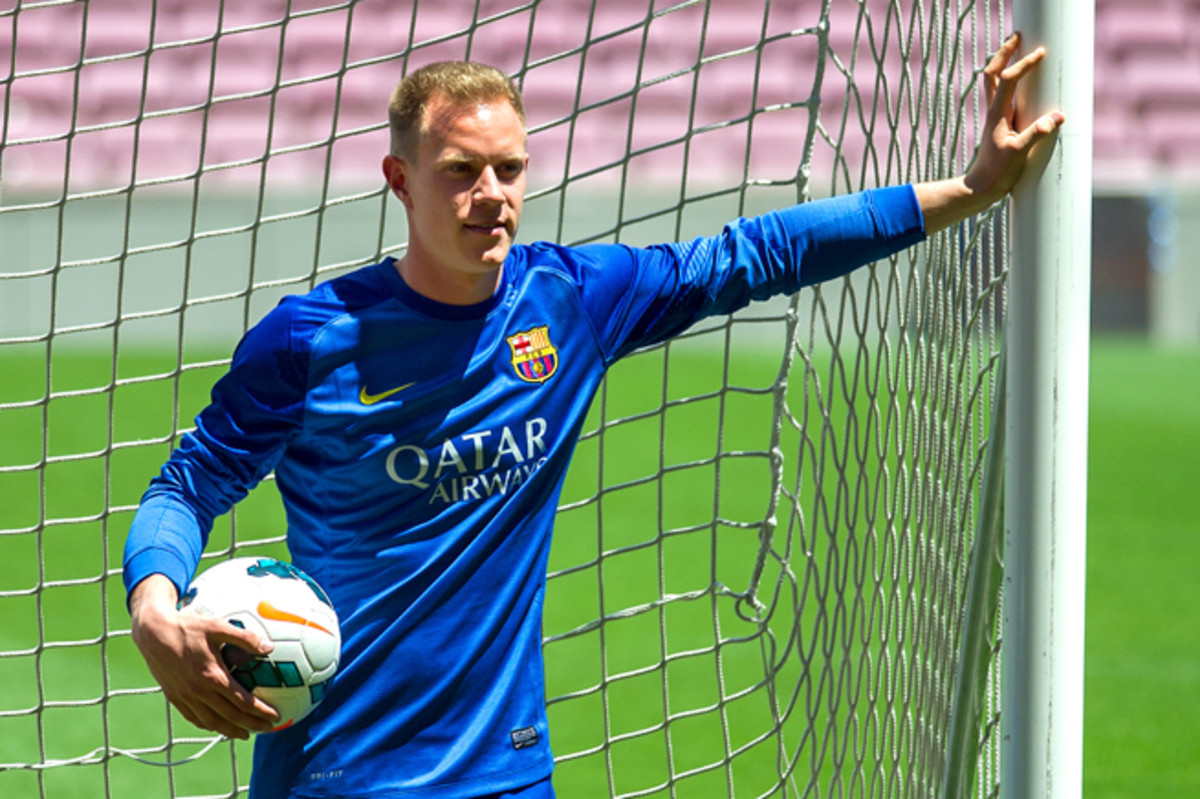 New Barcelona goalkeeper Marc Andre ter Stegen poses in his new uniform after signing a five-year deal with the Spanish power.