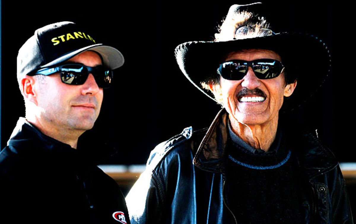 Driver Marcos Ambrose (left) welcomed his boss back in time for a major drive for charity.