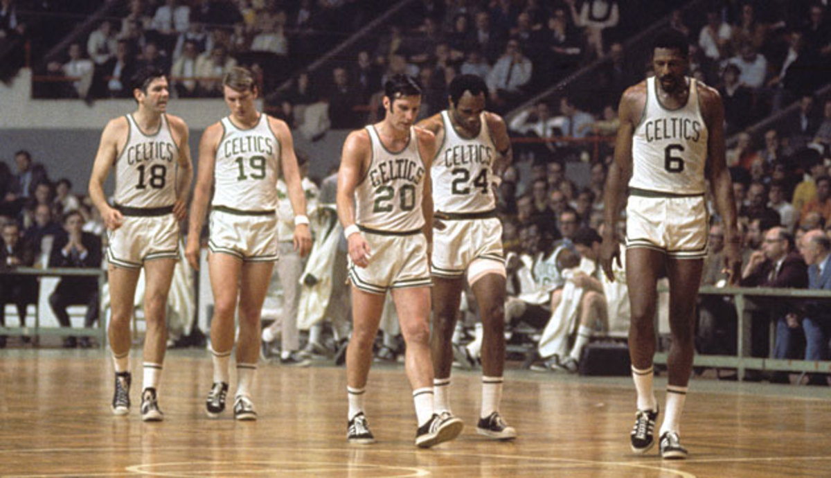 Russell (right) led the Celtics as both player and coach when they won titles in 1968 and '69, his last two seasons in uniform.