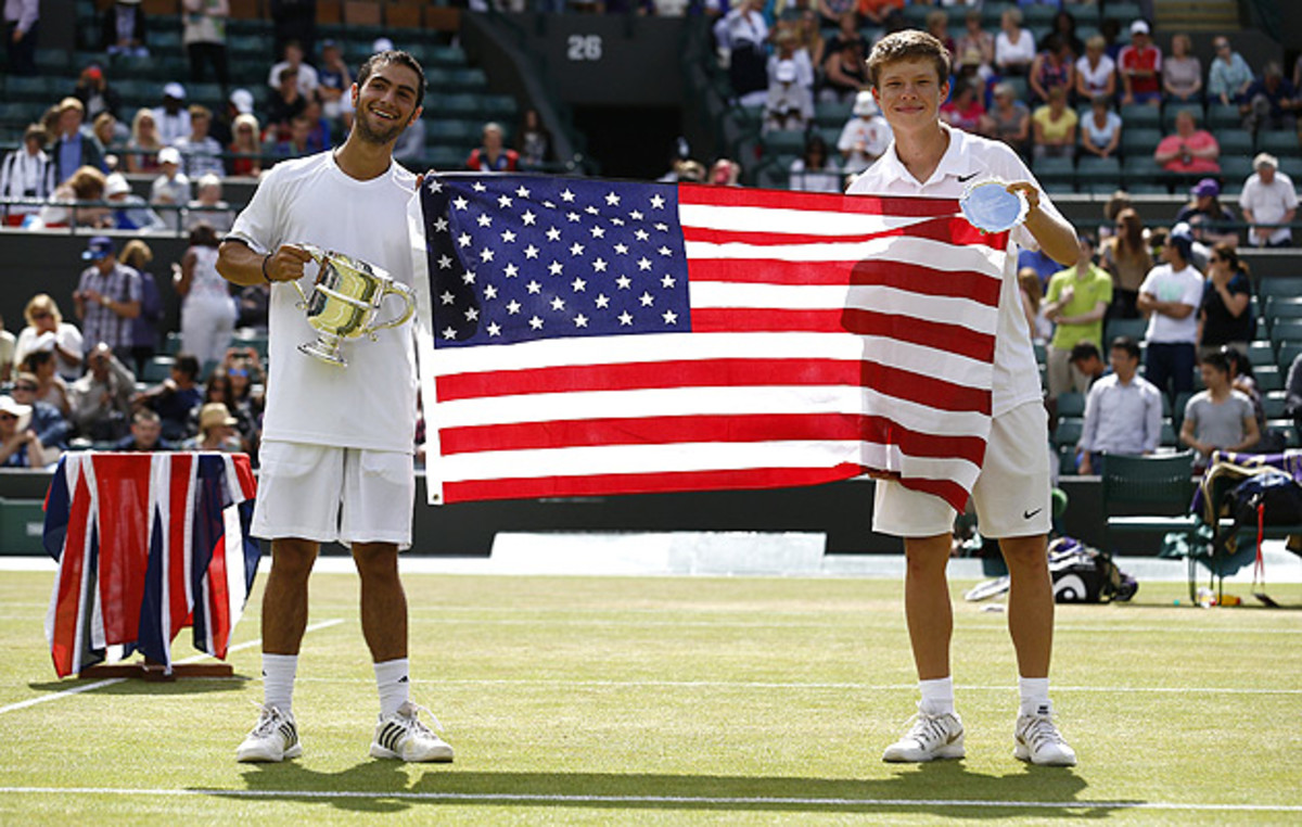 Noah Rubin (left) and Stefan Kozlov pose with the American flag after Rubin beat Kozlov in the Wimbledon boys' final this year.