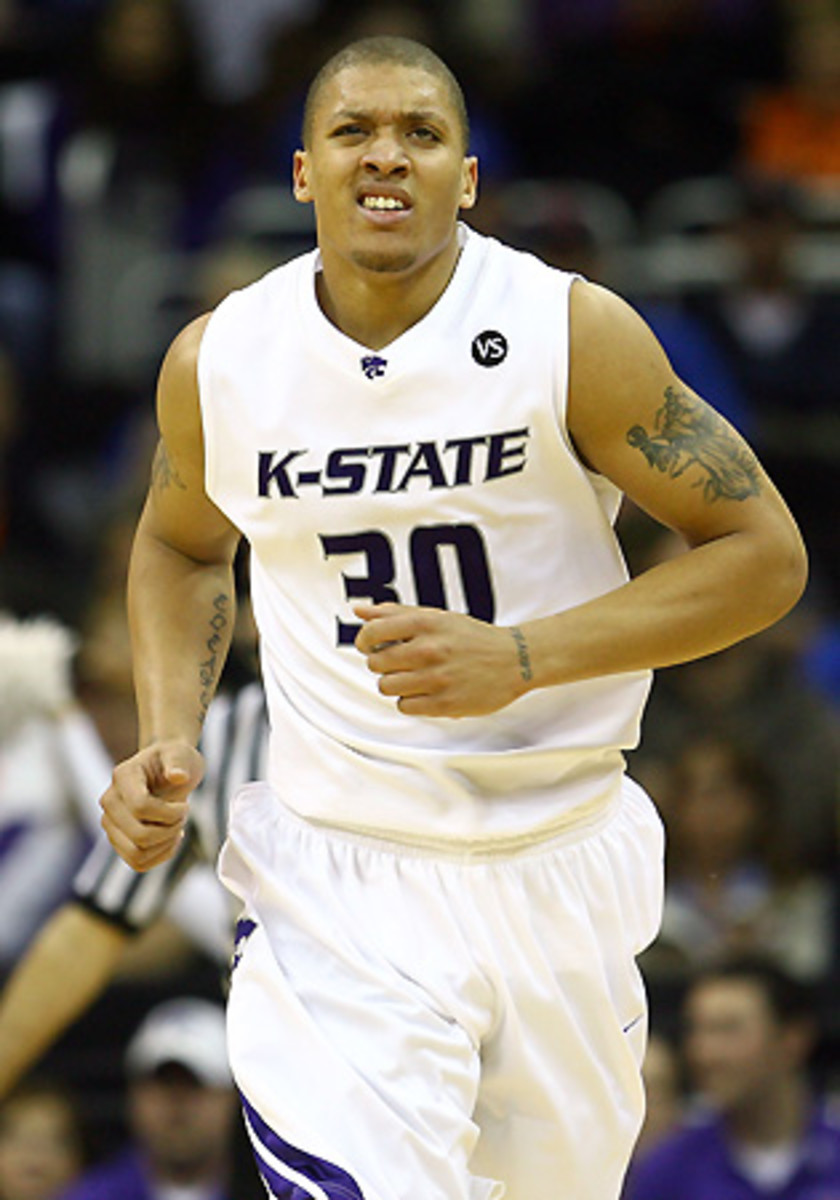 Malone pushed players such as Michael Beasley (above) to colleges and agents of his choosing.