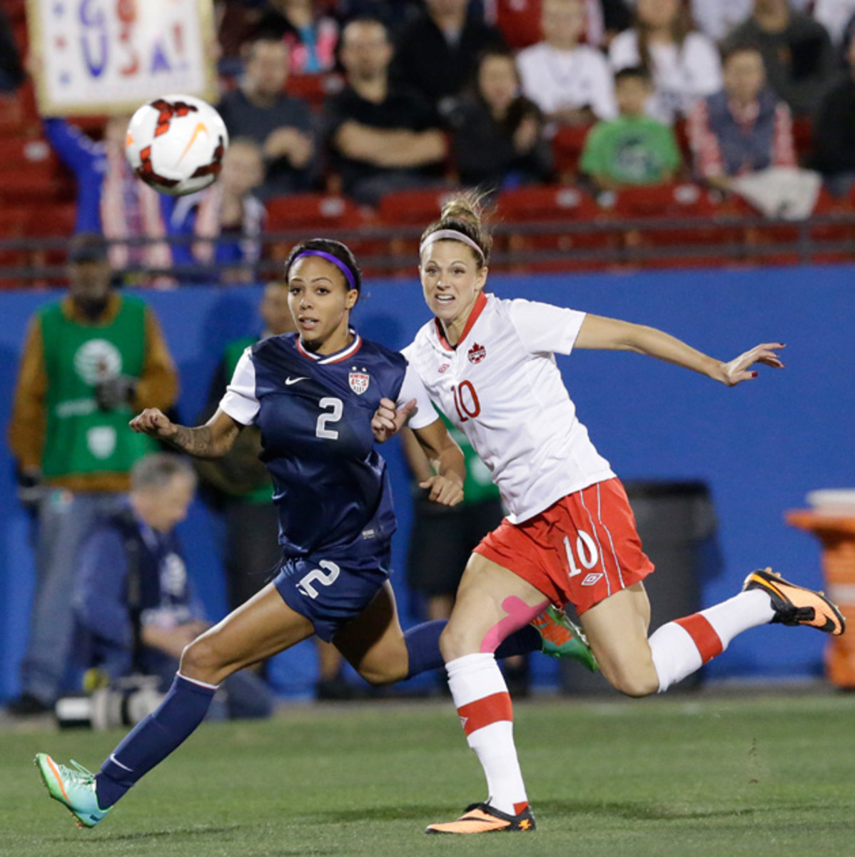 U.S forward Sydney Leroux (2) and Canada defender Lauren Sesselmann (10) chase the ball during the first half of a soccer game Friday, Jan. 31, 2014, in Frisco, Texas. The United States won 1-0.