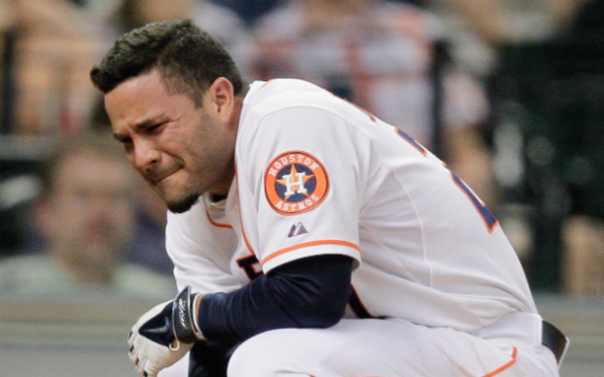 Jose Altuve was in obvious pain after getting hit in the hand. (Bob Levey/Getty Images)