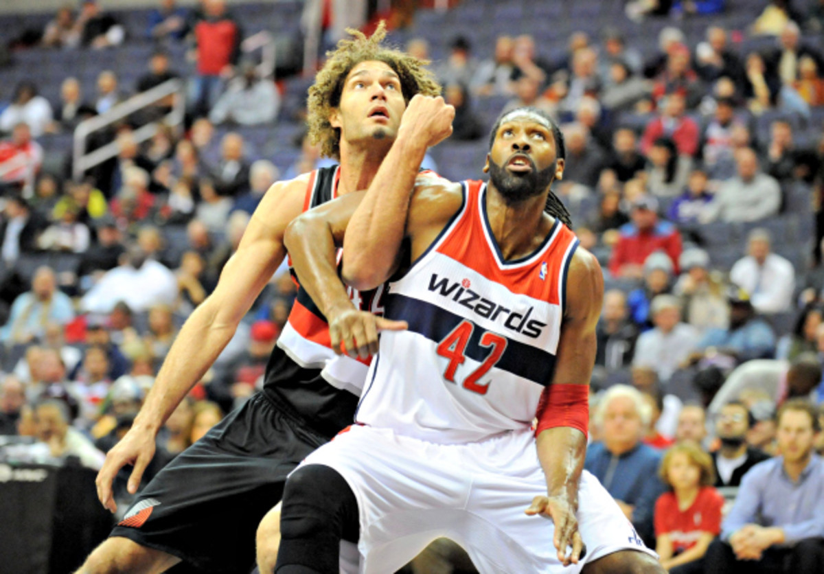 Without Nene (right), Washington would hurt for defense and rebounding. (Mitchell Layton/MCT via Getty Images)