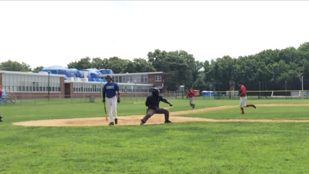 Over-the-top amateur ump gets every last ounce out of each strike call ...
