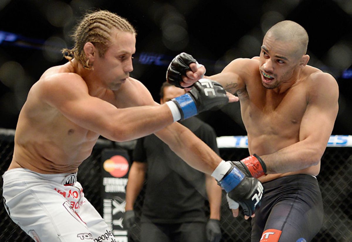 Renan Barao (right) remained unbeaten with a first-round TKO of Urijah Faber at UFC 169.