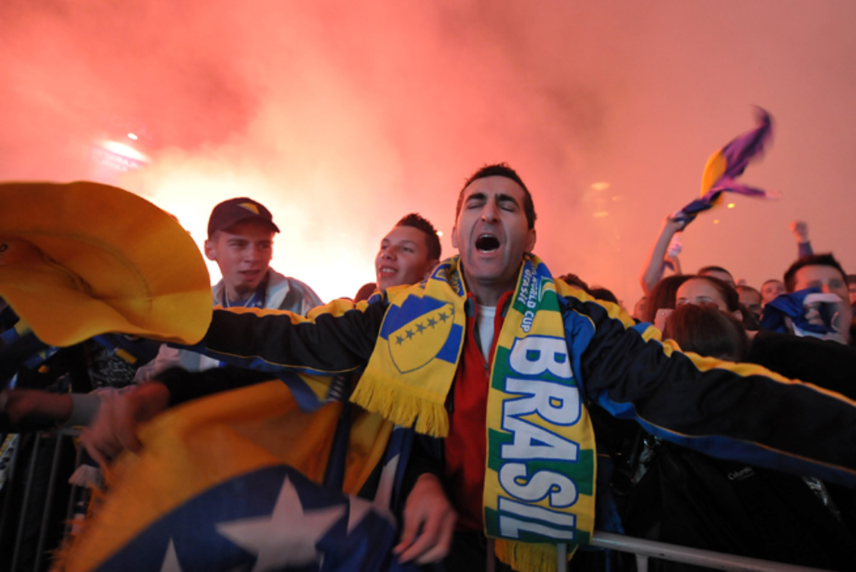 Fans, decked out in gear and emotion, flocked to a city square to watch a live broadcast of Bosnia-Herzegovina beating Lithuania 1-0 on Oct. 15, 2013, which resulted in qualification for this summer's World Cup in Brazil.