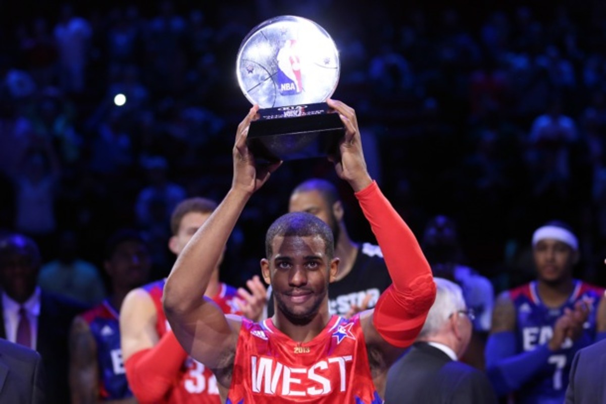 Chris Paul holds the 2013 All-Star Game MVP trophy. (Ronald Martinez/Getty Images)