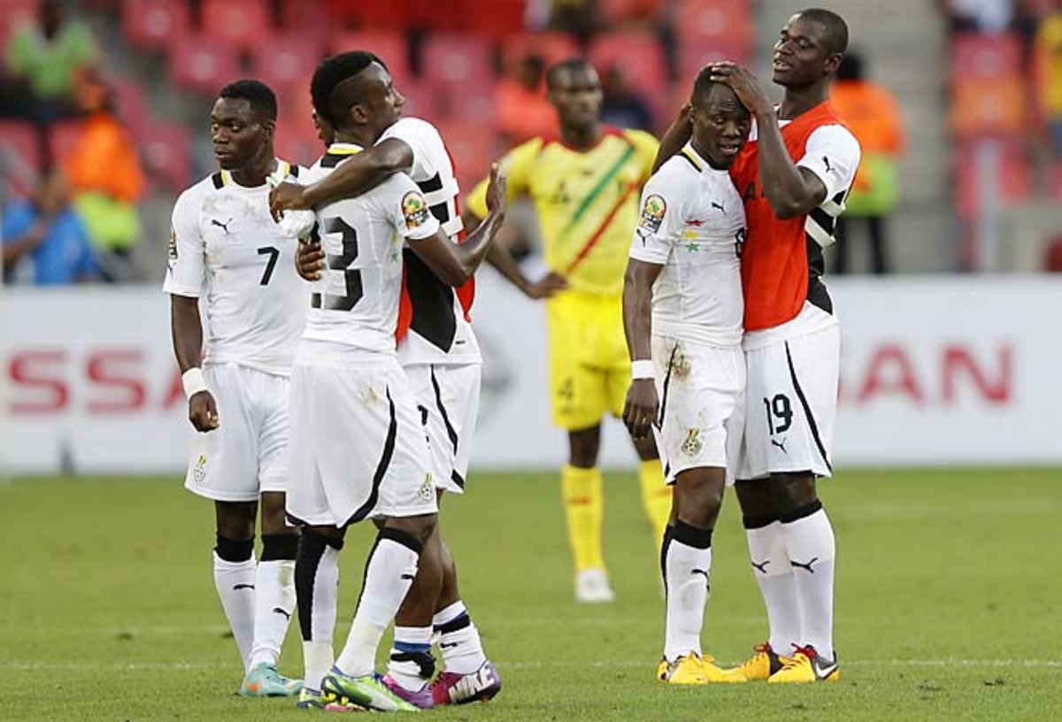 Ghana players hug after the final whistle in their African Cup of Nations Group B soccer match against Mali.