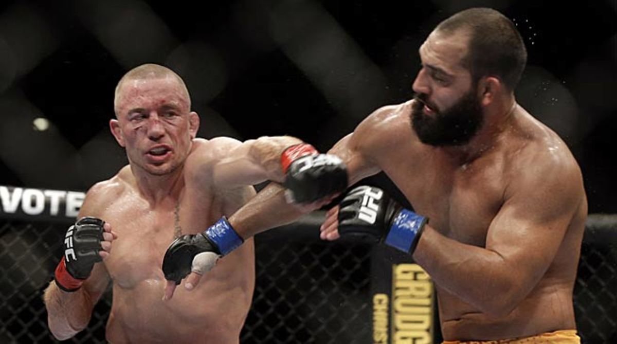 Georges St-Pierre (left) took as much of a beating as he gave in his win over Johny Hendricks at UFC 167. 