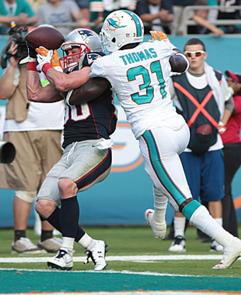Michael Thomas' breakup of a would-be Danny Amendola game-winning touchdown was the prelude to Thomas' interception. (J Pat Carter/AP)