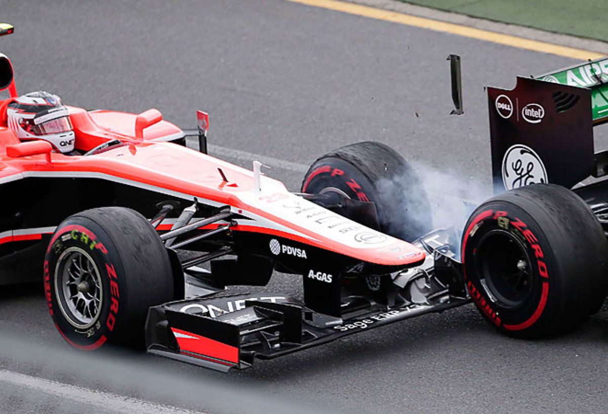 Marussia driver Max Chilton of Britain, left, and Caterham driver Giedo van der Garde of the Netherlands collide during the Australian Formula One Grand Prix.