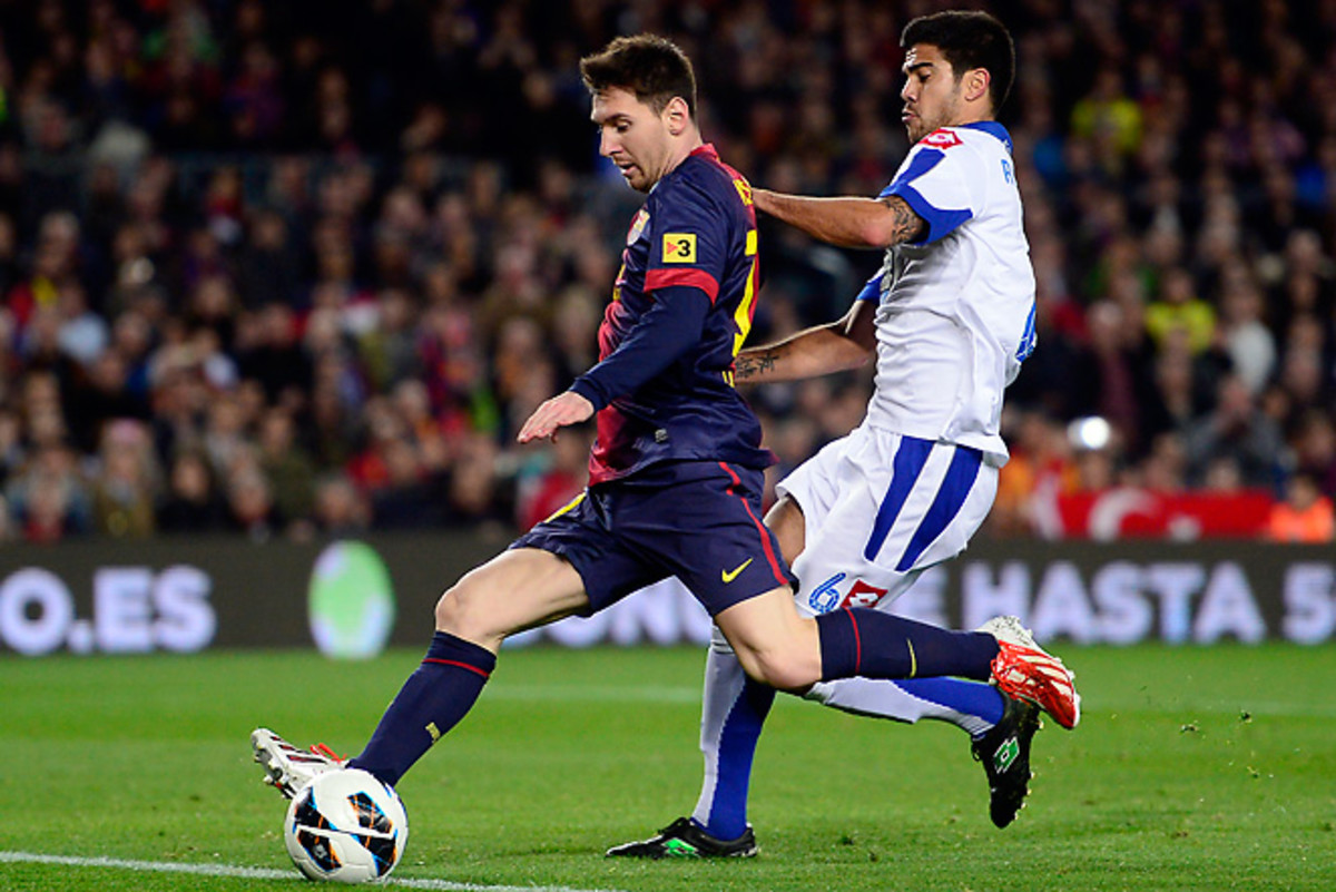 Lionel Messi passes Deportivo Coruna's Aythami Artiles en route to his goal in Barcelona's 2-0 win.