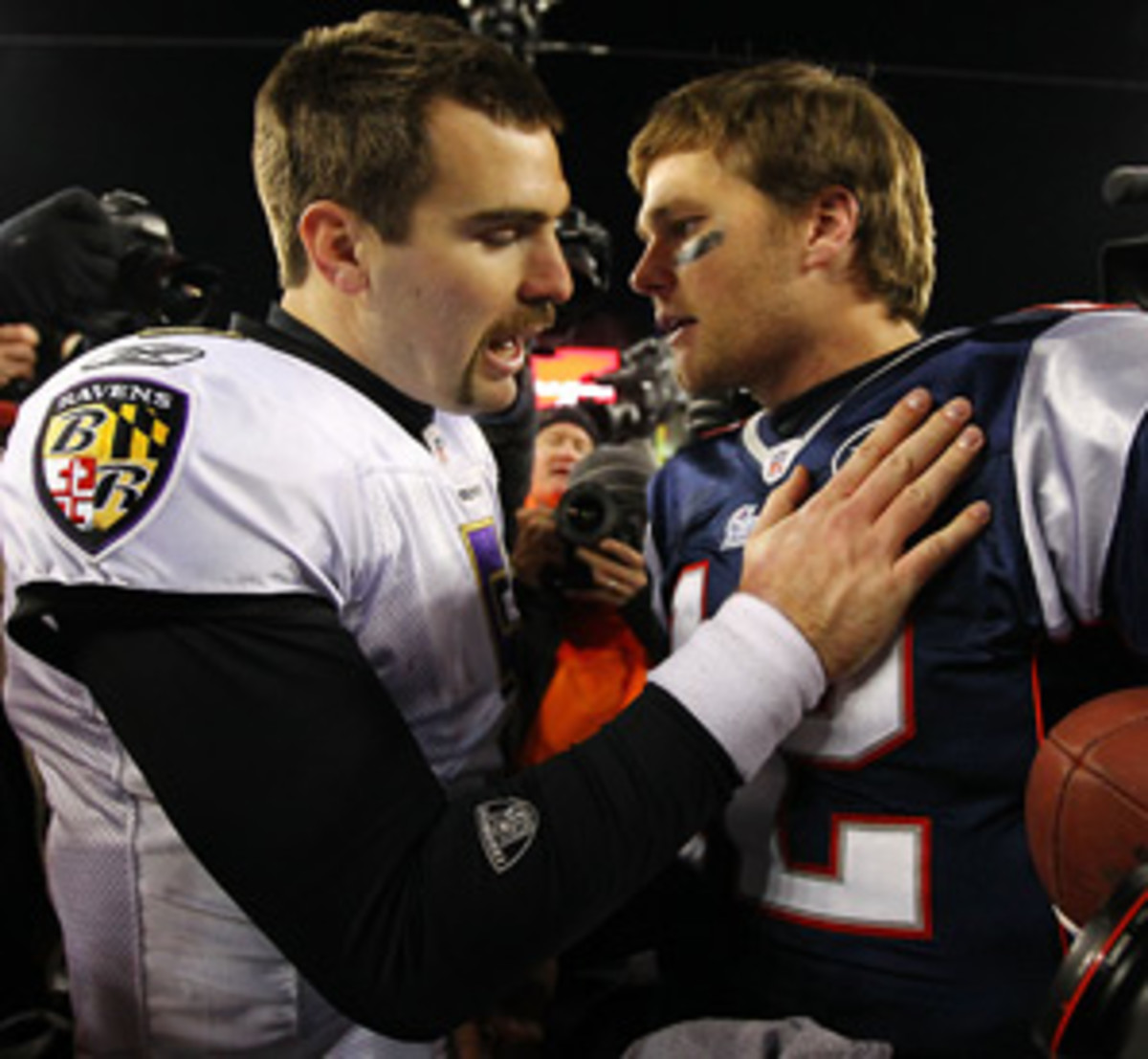 For the second straight year, the Ravens and Patriots will meet in the AFC title game. (Al Bello/Getty Images)