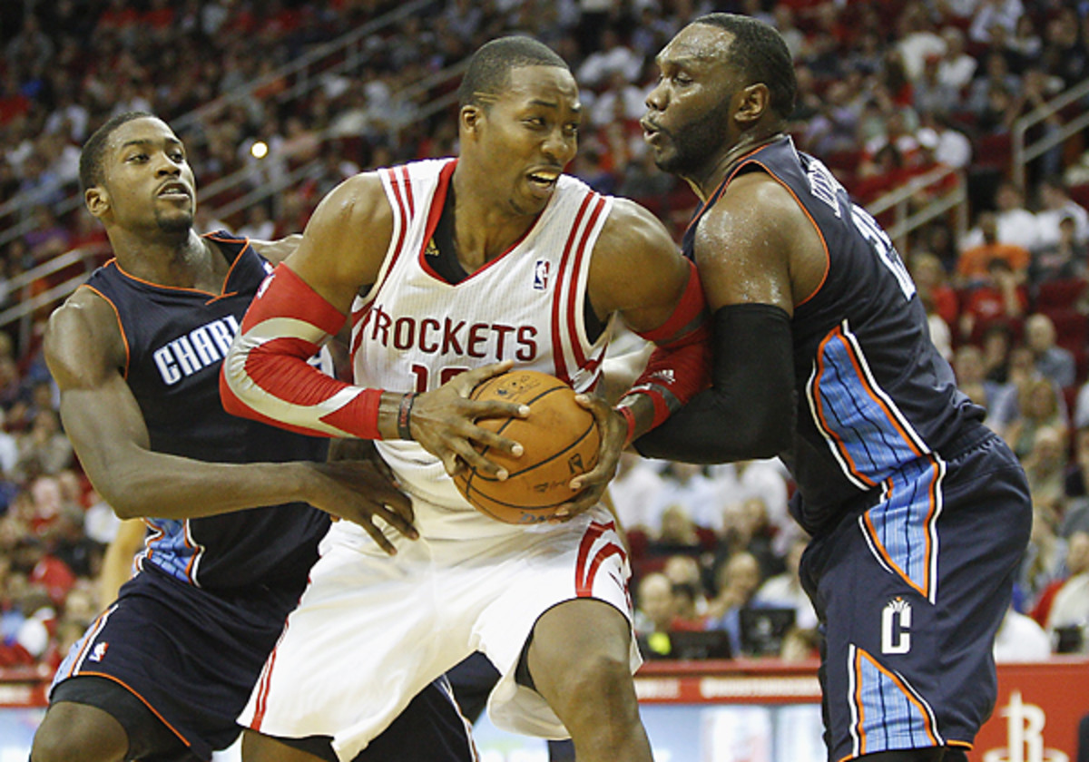 Dwight Howard's 26 rebounds against the Bobcats tied a career high for the newest member of the Rockets. (Bob Levey/Getty Images)