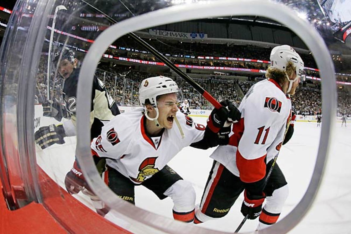 Erik Karlsson reacts as his Achilles tendon is severed by Matt Cooke's skate.
