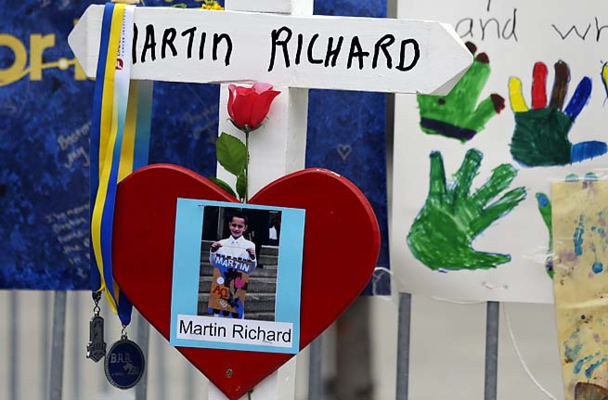 A photo of Martin Richard, 8, hangs at a memorial near the finish line of the Boston Marathon.