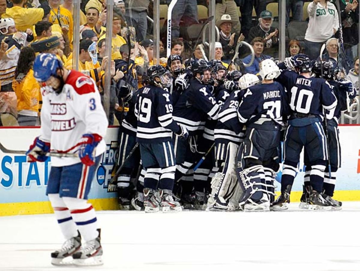 The jubilant Yale Bulldogs mob their captain, Andrew Miller, after he scored his overtime game-winner.