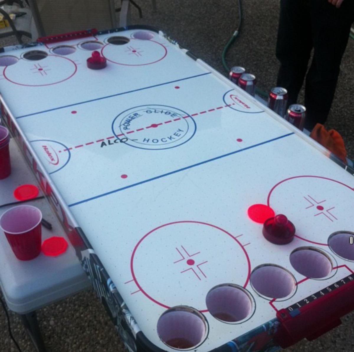 Canadian Invents Alcohockey, a Hybrid Between Air Hockey and Beer Pong -  Sports Illustrated