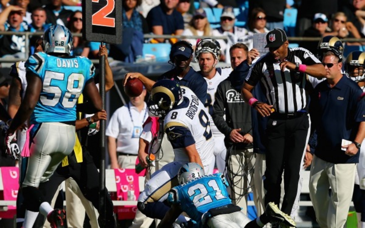 Rams QB Sam Bradford injured his knee on this hit from Panthers' Mike Mitchell. (Streeter Lecka/Getty Images)