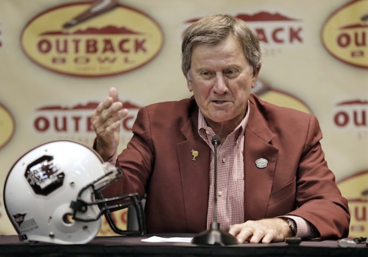 The Ol' Ballcoach demonstrates proper wrist technique for maximum efficiency in Bloomin' Onion consumption. (AP)