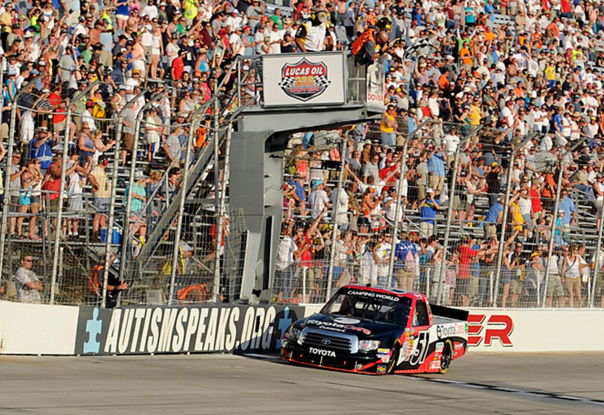 Kyle Busch took a step toward a NASCAR triple-header in Dover by winning the Truck Series race Friday.