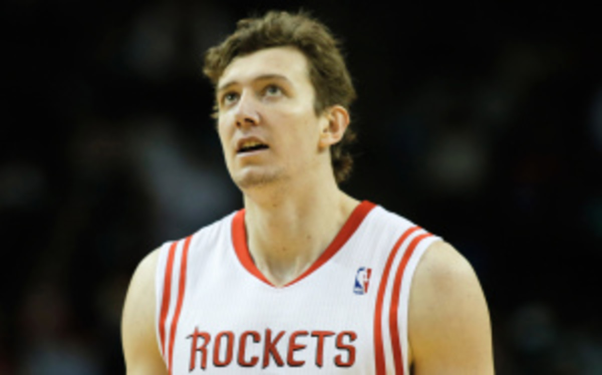 Omer Asik has played just 18.3 minutes per game for the Rockets this season, down from 30 per game in 2012-13. (Scott Halleran/Getty Images)