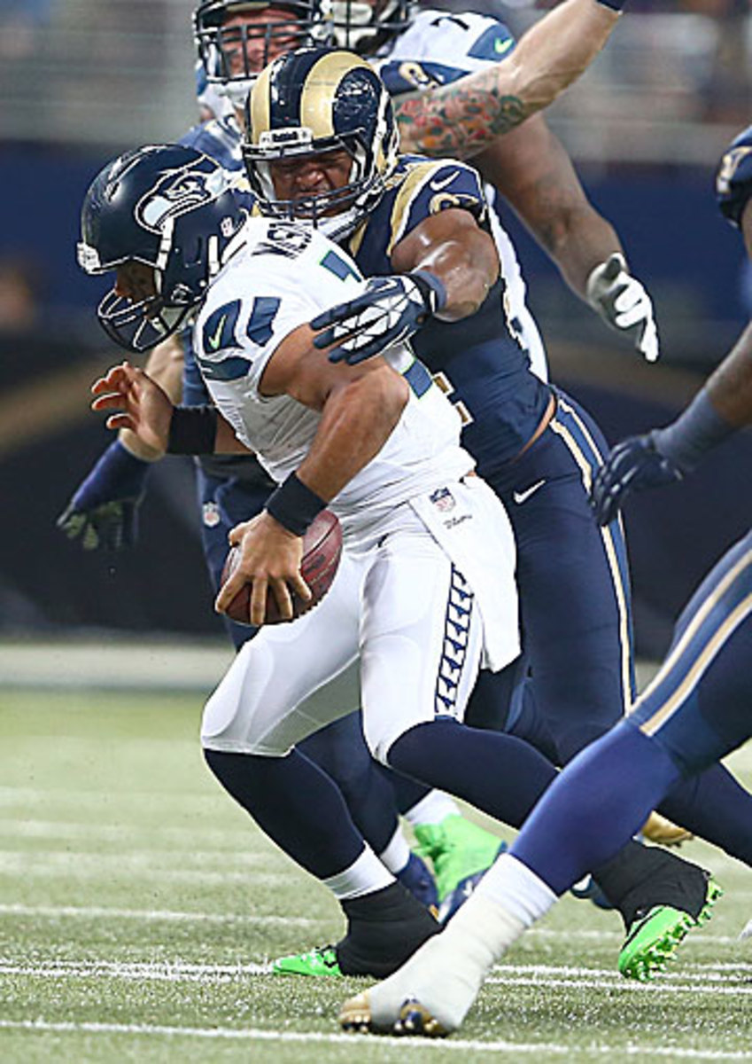 Seattle’s porous line allowed seven sacks of Russell Wilson, the most-hurried quarterback in the league this season. (Andy Lyons/Getty Images)