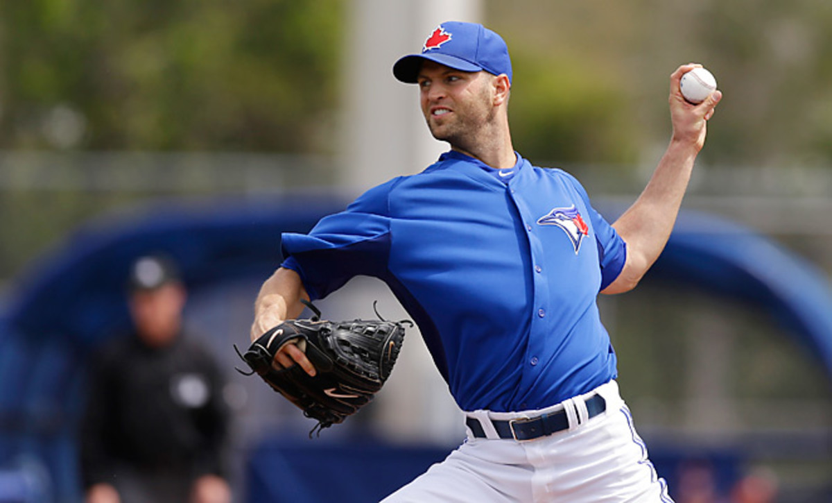 J.A. Happ pitches in a spring training game. Happ signed a two-year deal with the Blue Jays Wednesday.