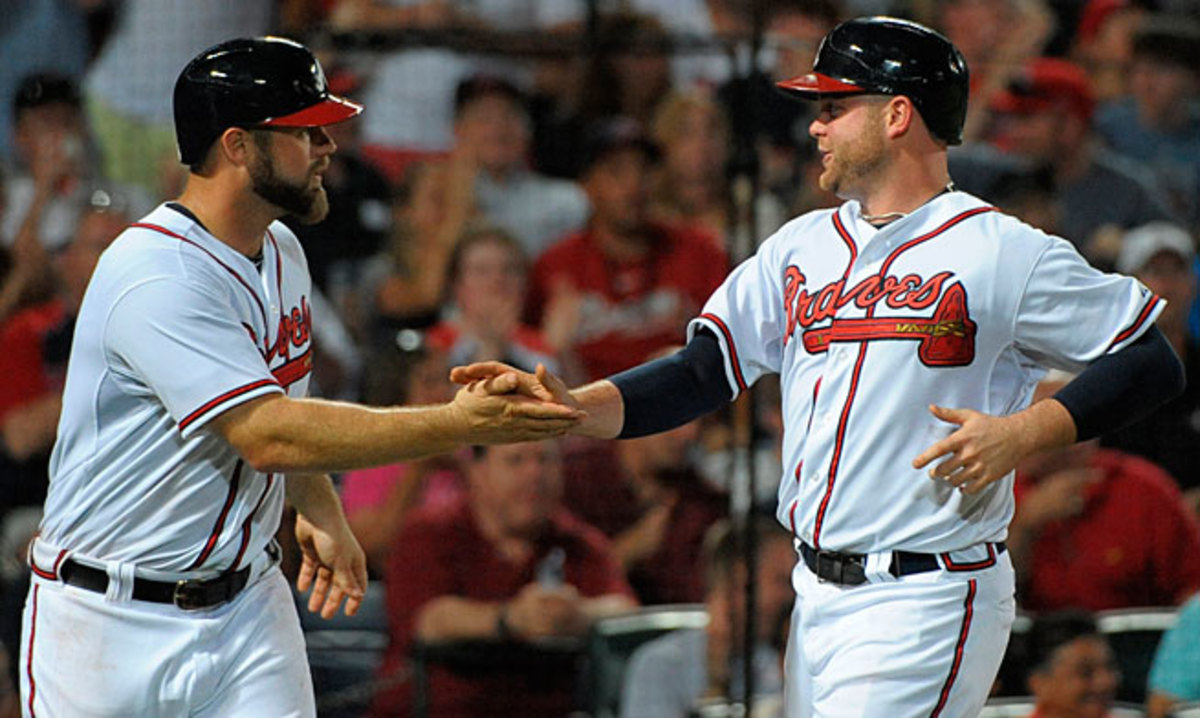 Evan Gattis (left) is just one option to replace seven-time All-Star Brian McCann at catcher in Atlanta.