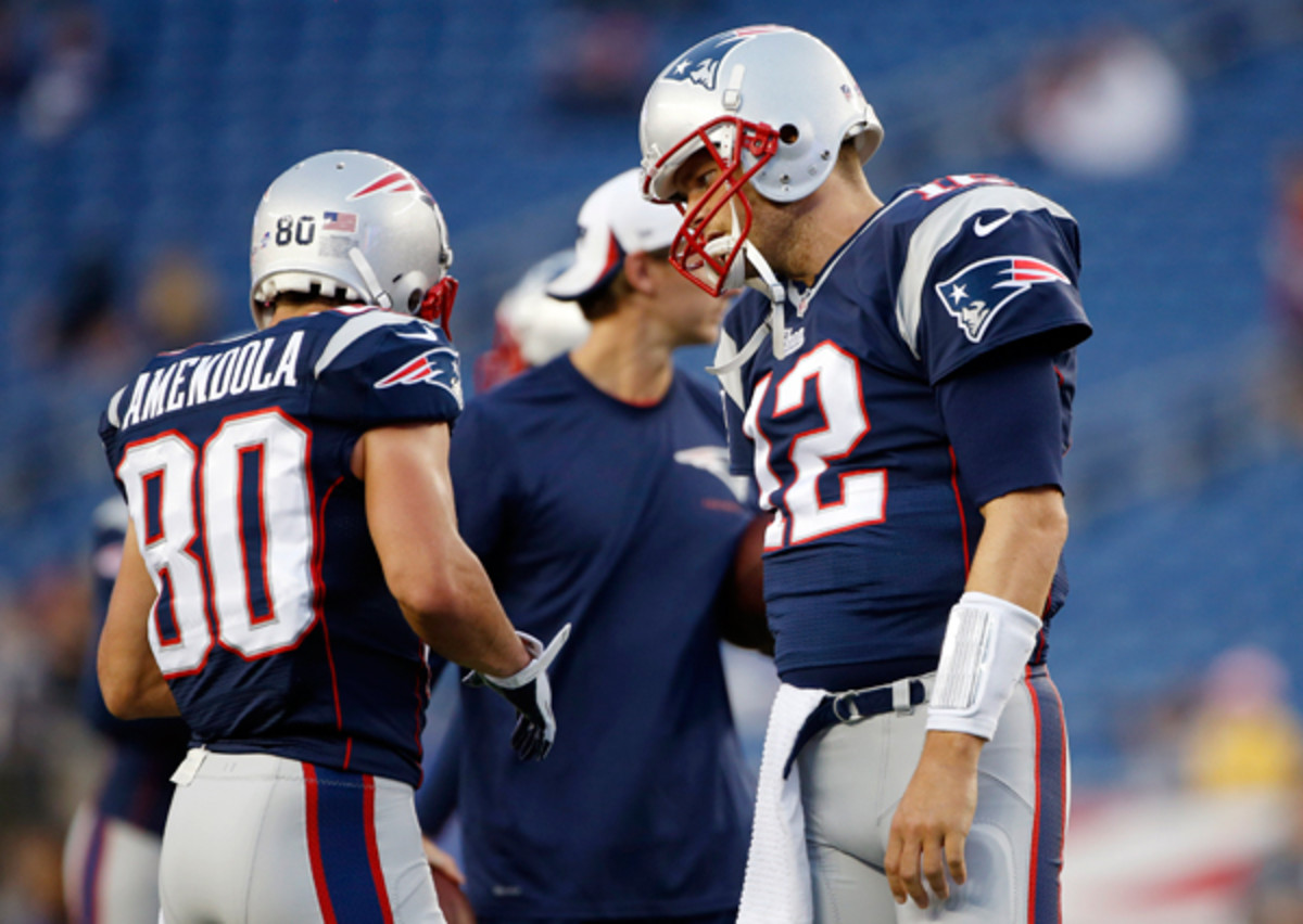 It might take a while for om Brady to get on the same page with his new receivers. (Elise Amendola/AP)