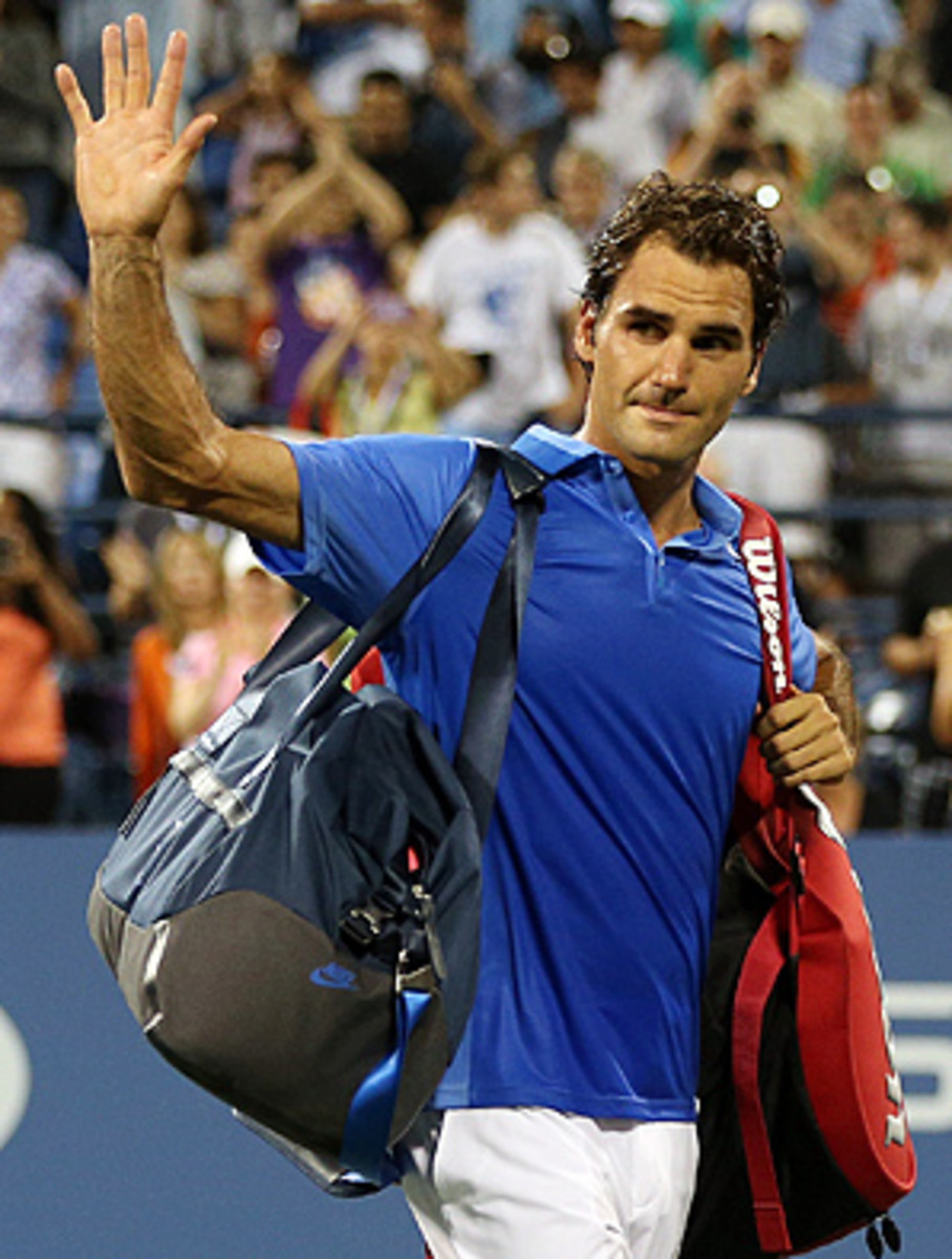 Roger Federer waves goodbye to the U.S. Open crowd after his surprising loss to Tommy Robredo in the fourth round.