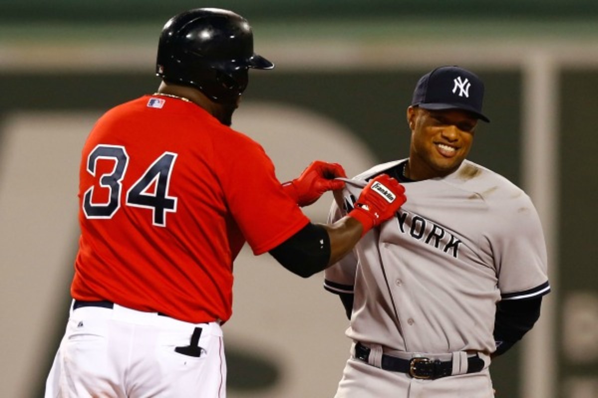 David Ortiz (left) and Robinson Cano have been known to get chummy on the field. (Jared Wickerham/Getty Images)