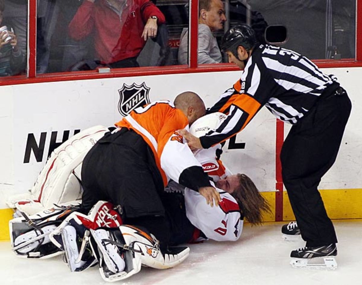 Ray Emery and Braden Holtby engage in a one-sided goalie fight.