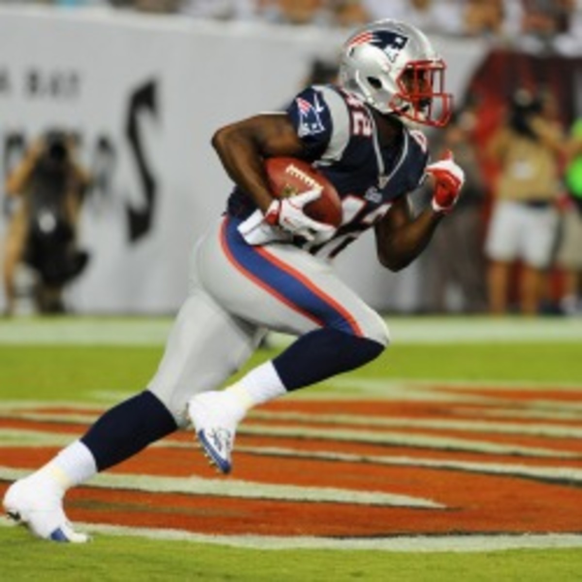 Patriots running back Jeff Demps plans a return to the track leaving his future with the team in doubt. (Al Messerschmidt/Getty Images)