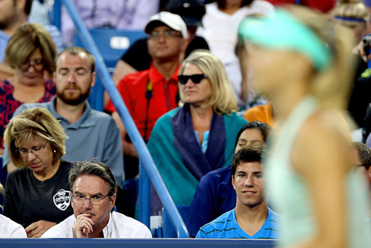 Jimmy Connors (bottom left corner) coached Maria Sharapova for only one match during their brief partnership. (Matthew Stockman/Getty Images)